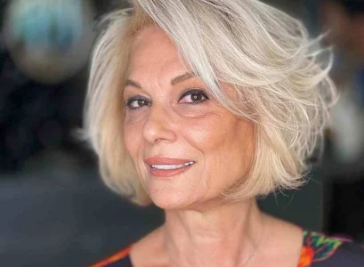voluminous bob side swept bangs trendy short hairstyle women over 60