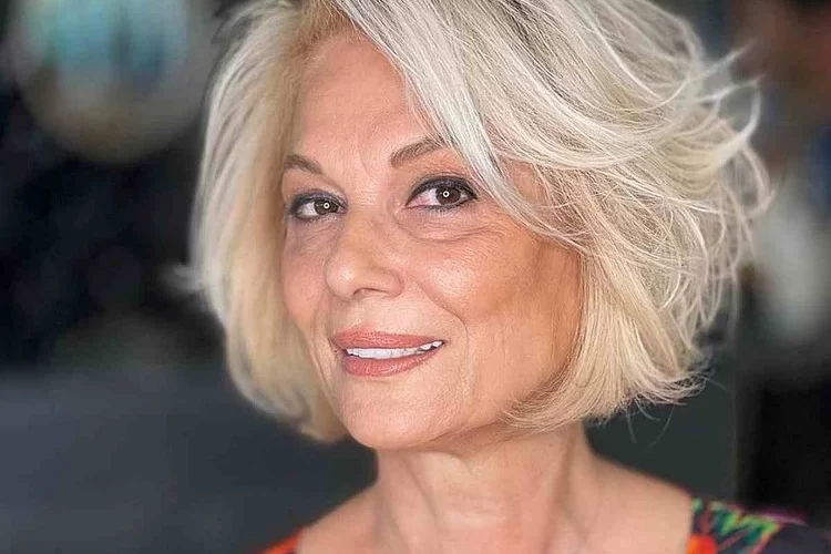 voluminous bob side swept bangs trendy short hairstyle women over 60