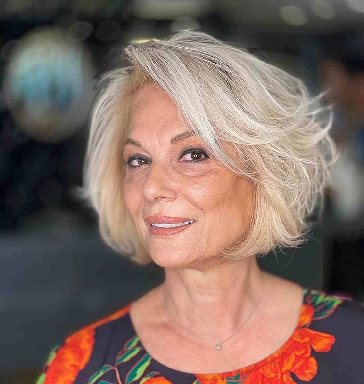 voluminous bob side swept bangs trendy short hairstyle women over 60