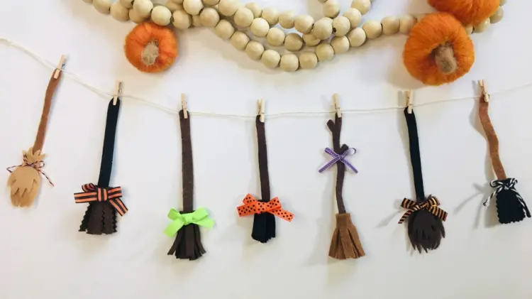 witch broom craft with felt for a decorative garland for halloween party