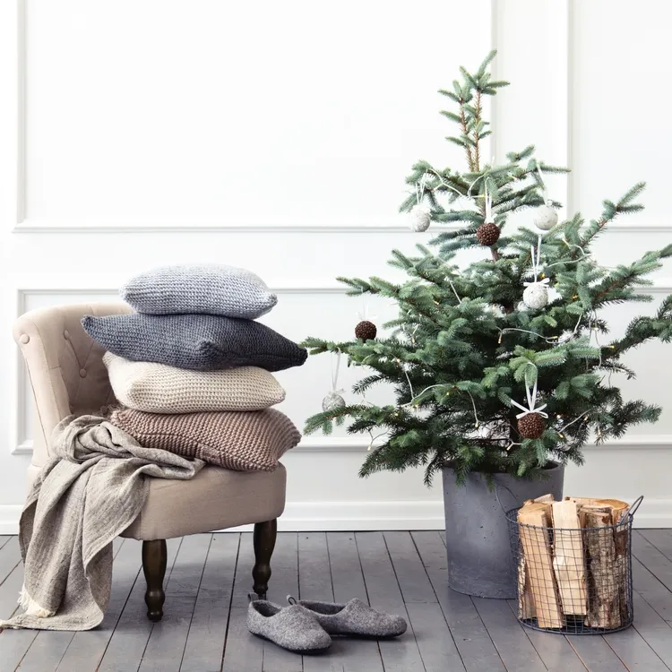 combine white ornaments and pine cones christmas tree decor