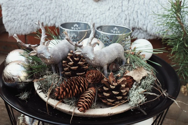 scandinavian decoration for christmas tray with pine cones and decorations