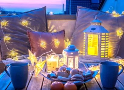 balcony christmas decorating with lights lanterns and candles