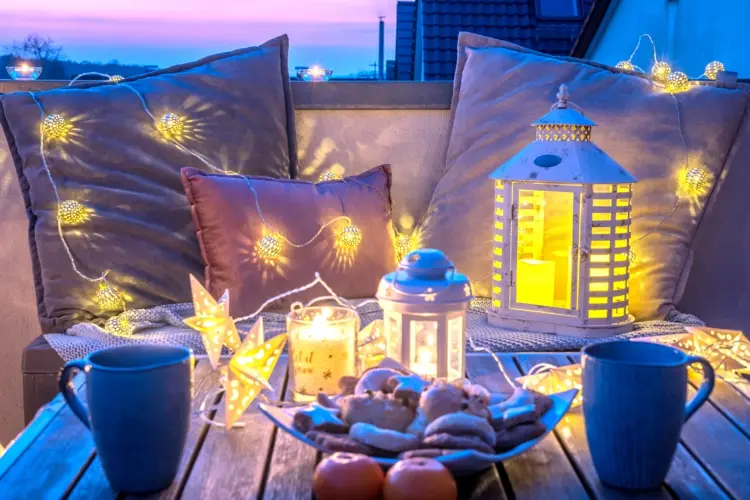balcony christmas decorating with lights lanterns and candles