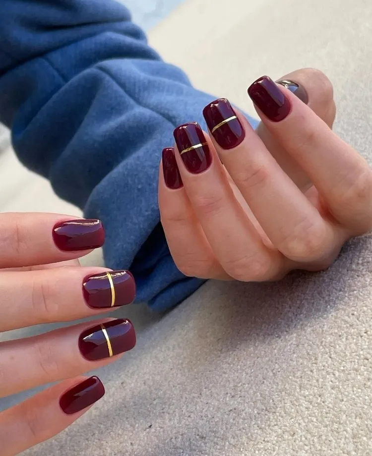 burgundy red and gold nail art nail polish trend 2023