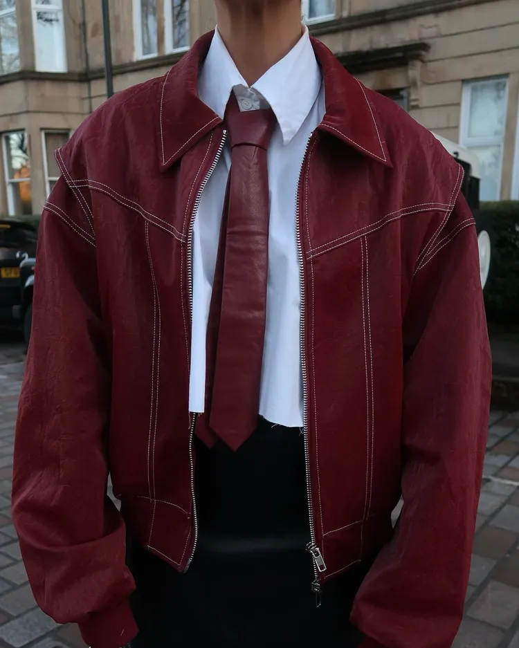 cherry red jacket leather tie white shirt black skirt winter 2023 fashion trends outfit ideas