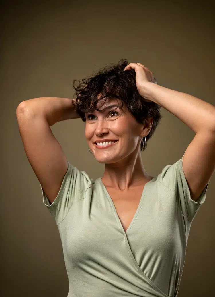 curly layered long pixie hairstyle older woman