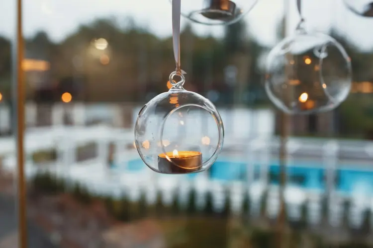 decorate balcony for christmas with hanging tree ball ornaments with tealights