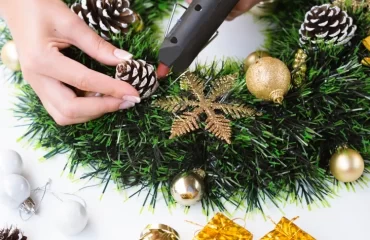 decorate christmas wreath with snow covered pine cones