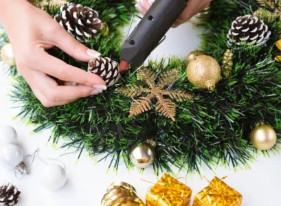 decorate christmas wreath with snow covered pine cones