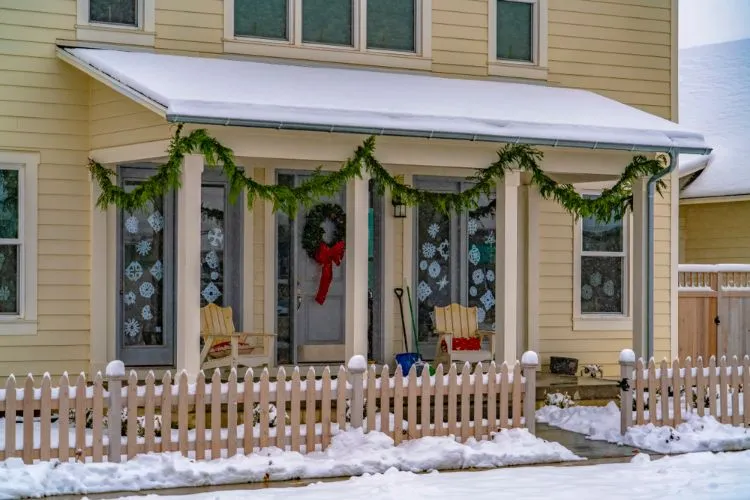 decorate windows with paper snowflakes