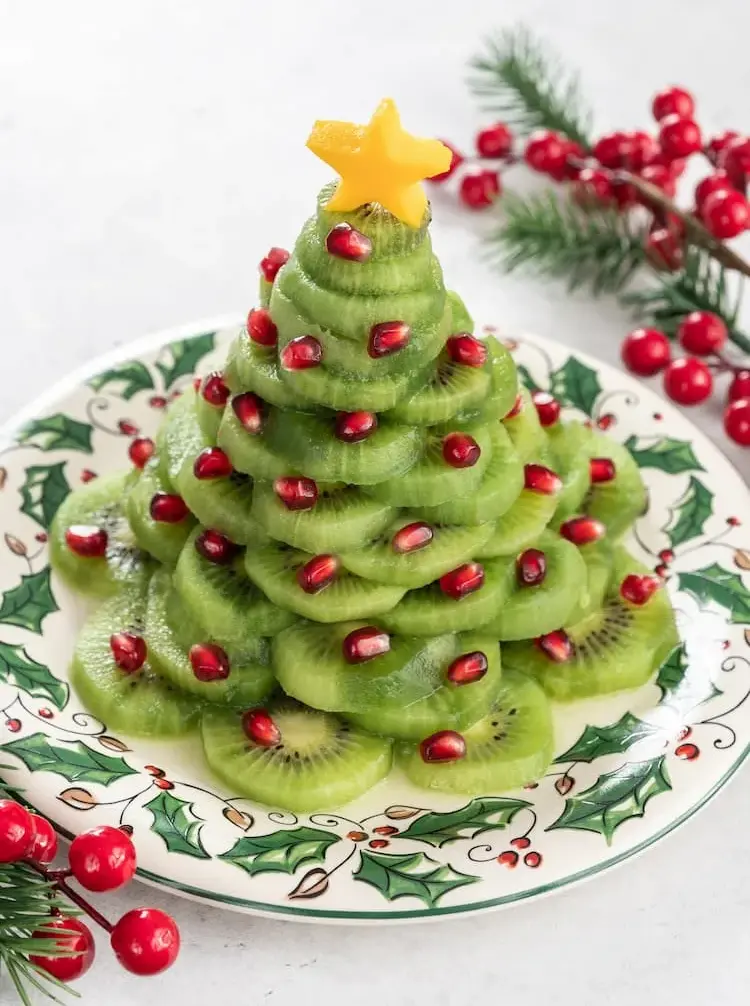 festive fruit platter christmas tree made of kiwi and pomegranate seeds