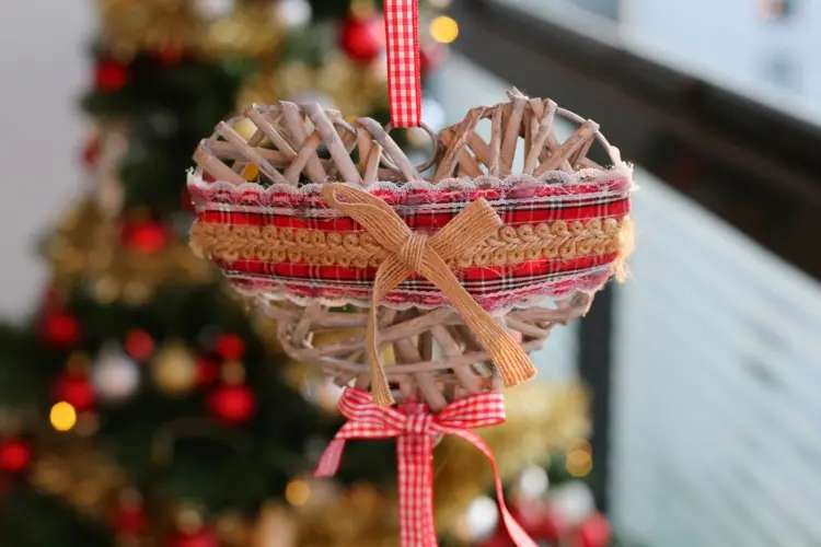 hanging christmas decoration for outdoors with heart and ribbons in red white