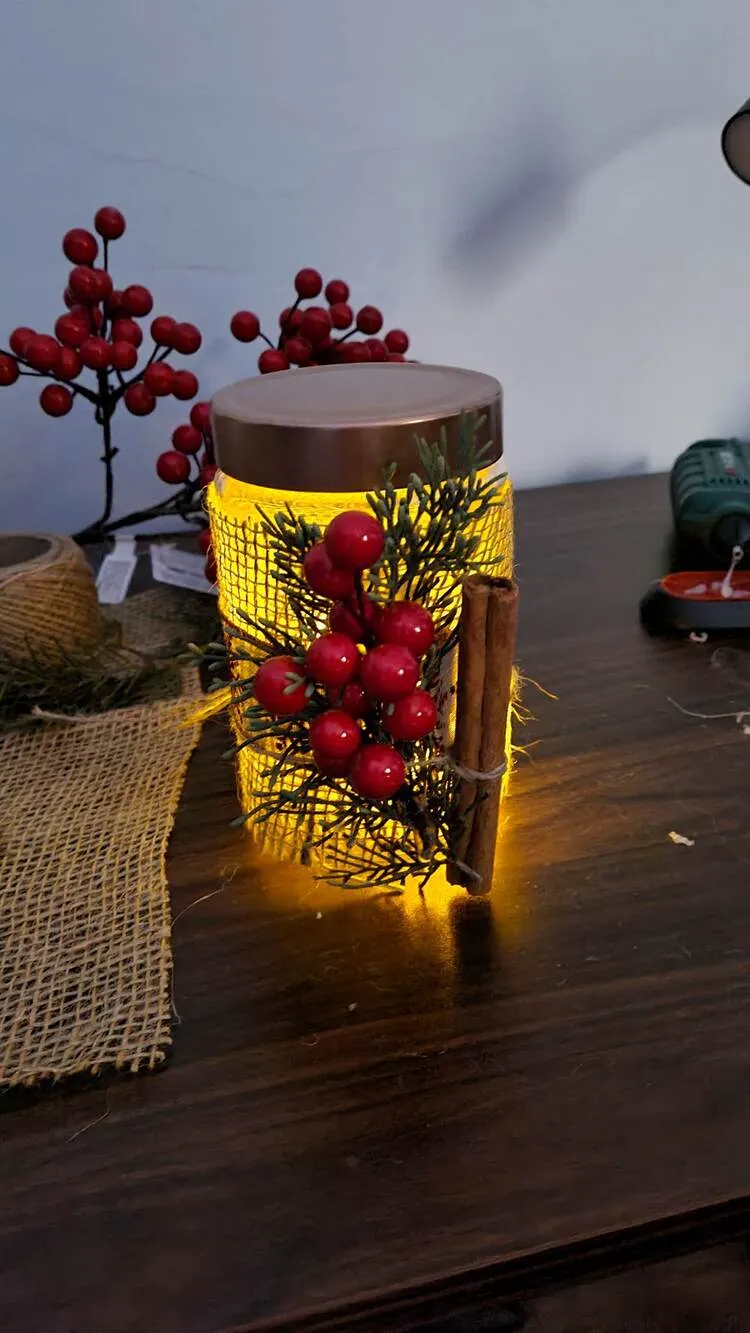 make christmas tealight holders with glass jars red berry cinnamon sticks