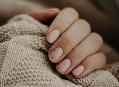 minimalist nude november nails gold dot design
