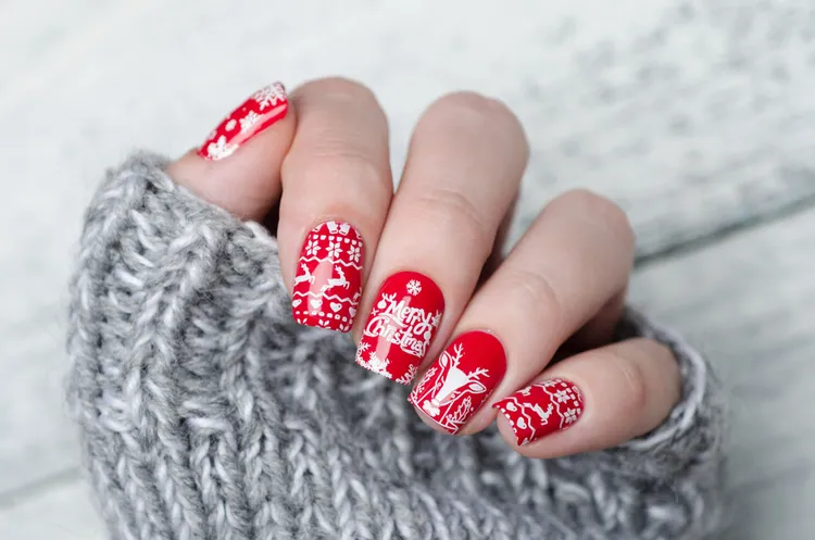 red and white nail art with christmas patterns short nails