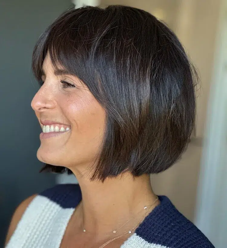 rejuvenating bob haircut with curtain bangs for women 40 50 years old
