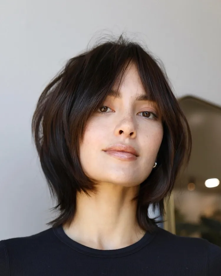shaggy haircut layered bob with curtain bangs for oval face