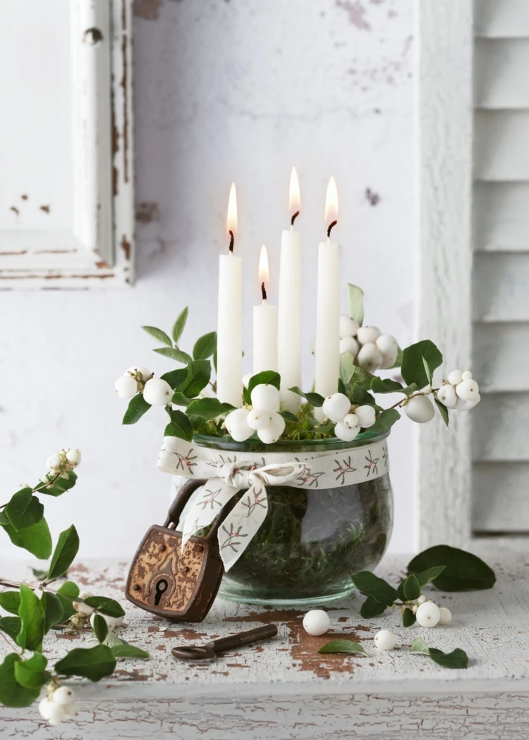 simple advent wreath in glass bowl with twigs and white berries