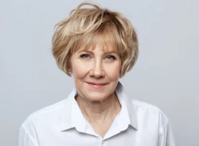 voluminous short bob straight choppy bangs woman over 60