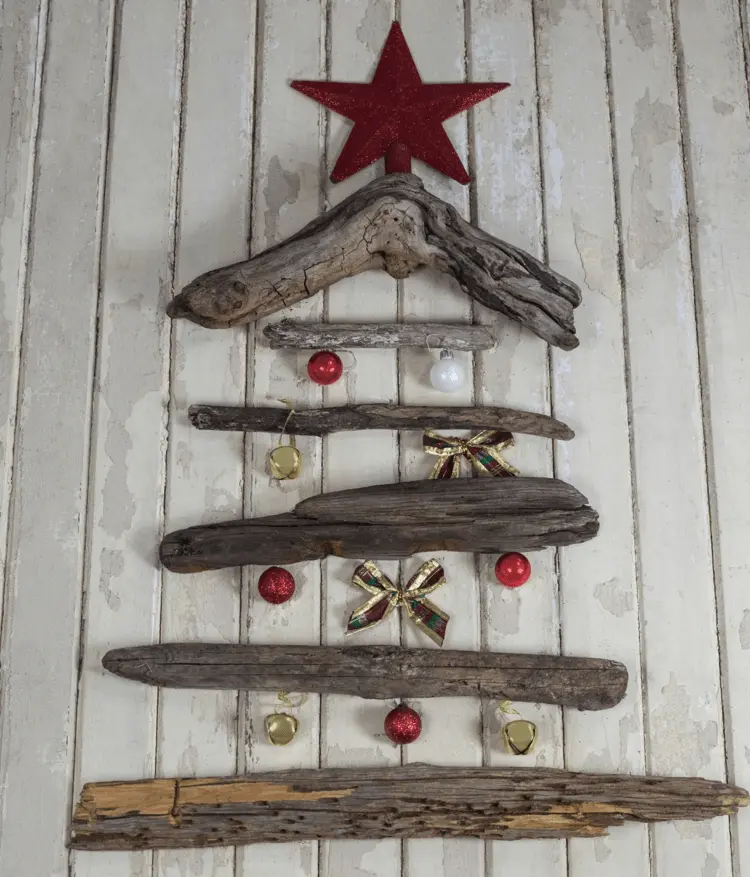 wall decoration at christmas time with self made christmas tree from driftwood