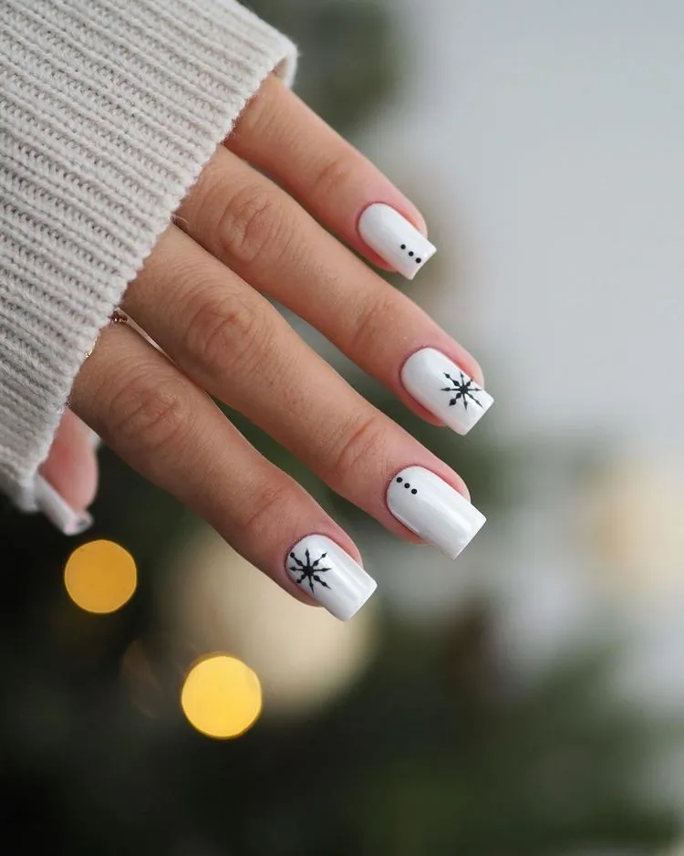 white square nails with snowflake pattern