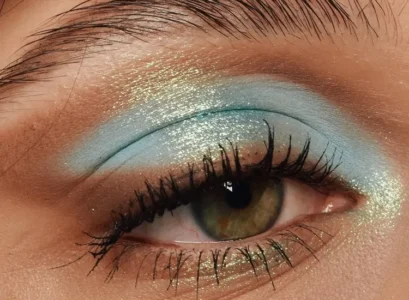 blue eye makeup idea brown gold glitter winged eye
