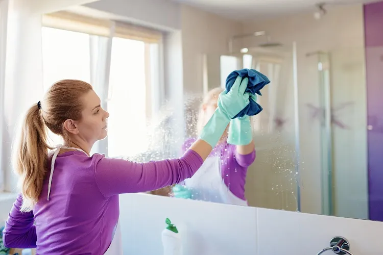 cleaning the bathroom before you invite guests over for the holidays