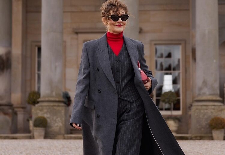 formal winter clothes woman over 70 gray coat two piece suit red turtleneck