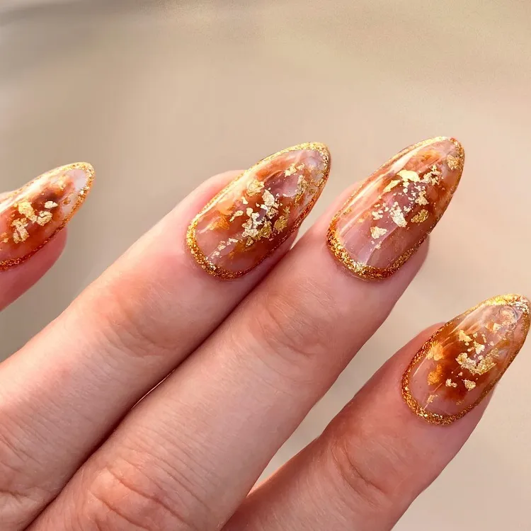 glitter nail window gold leaf abstract geode manicure design idea 2024 nye