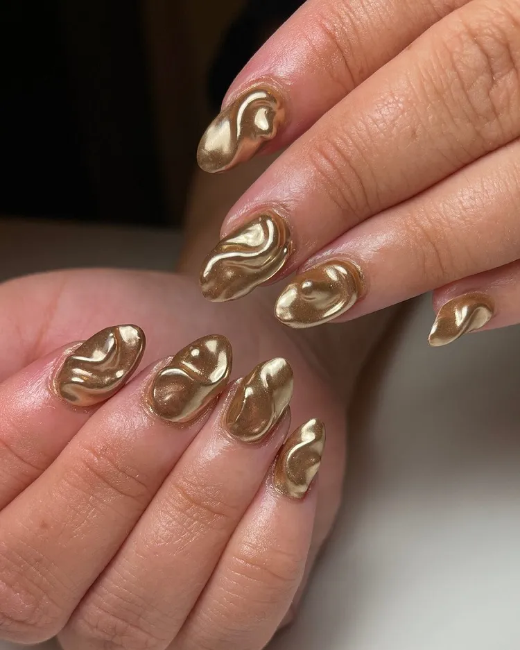 gold 3d chrome nail design swirls