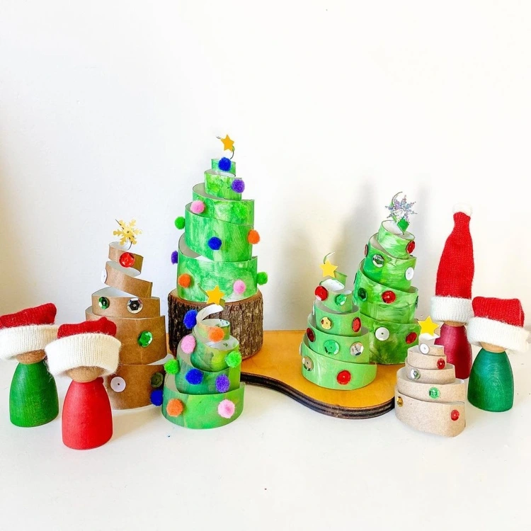 making spiral fir trees from toilet rolls with children for christmas