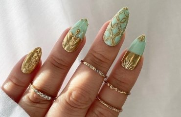 mint green nails gold ornaments festive manicure 2023