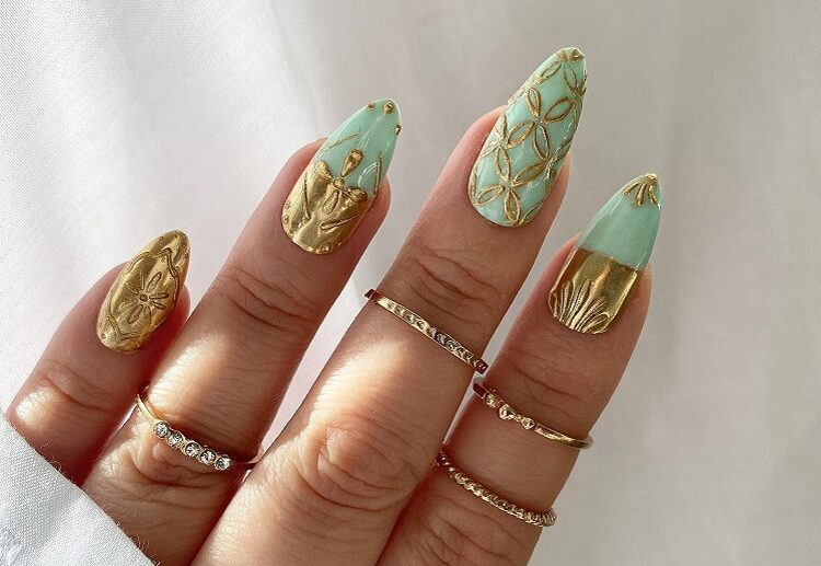 mint green nails gold ornaments festive manicure 2023