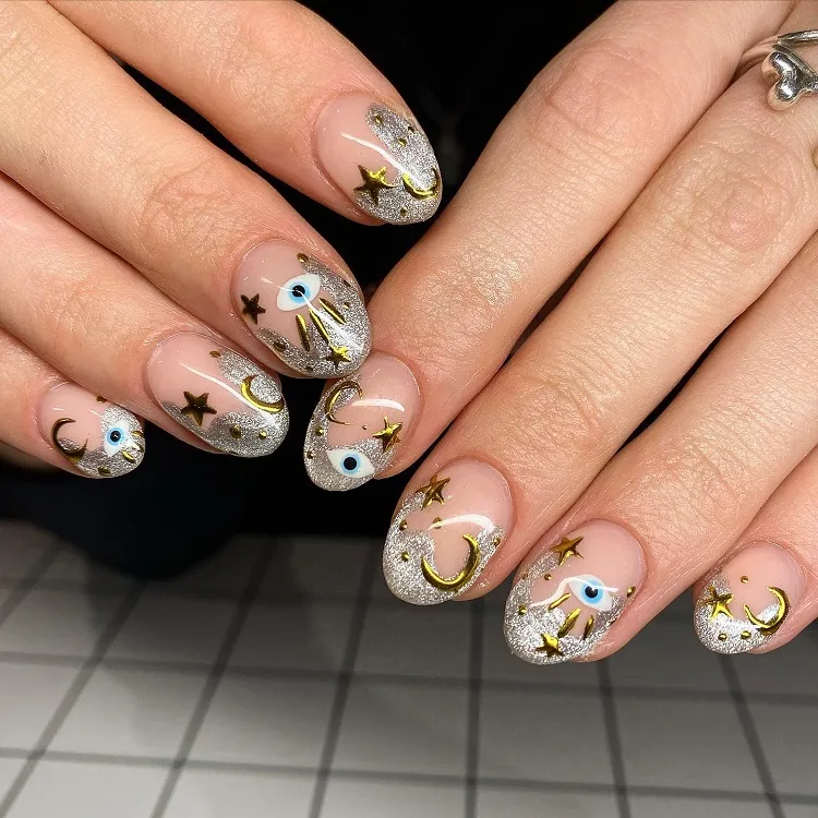 silver cat eye and chrome abstract french tips evil eye gold stars moon nail art