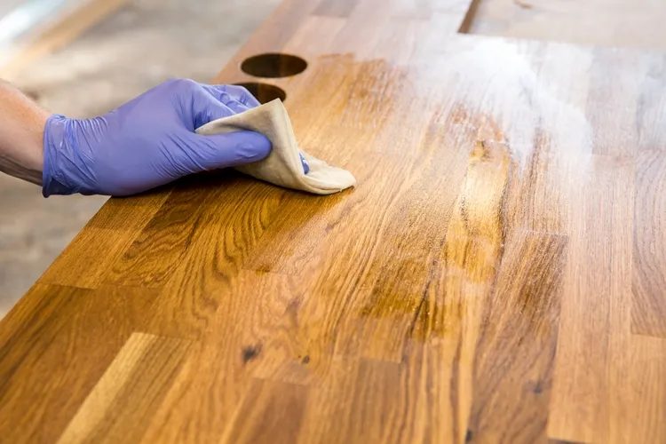 before you start treating heat stains on wood always clean the surface beforehand