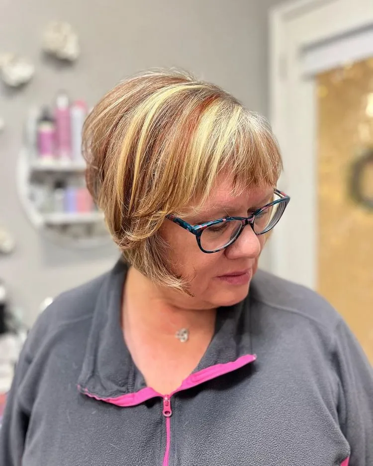 trendy stacked bob for older women with short bangs