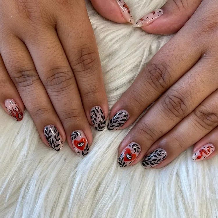 abstract red and black valentine's day nails with leaves hearts and flames decorations