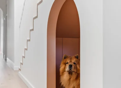 arched under stairs nook for a dog room