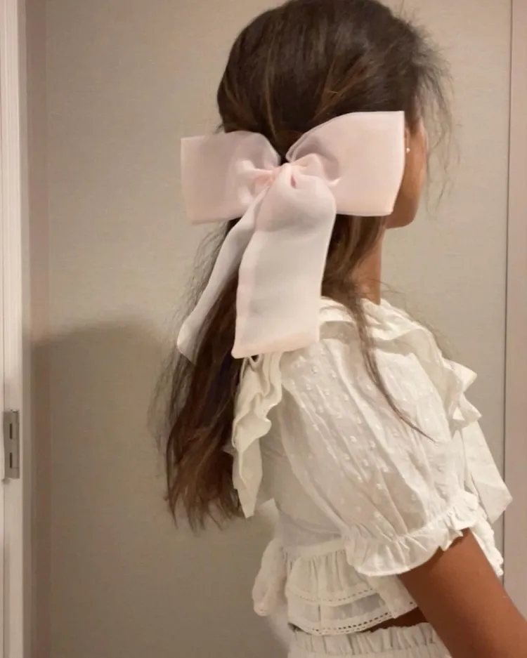 coquette style hairstyle with bow