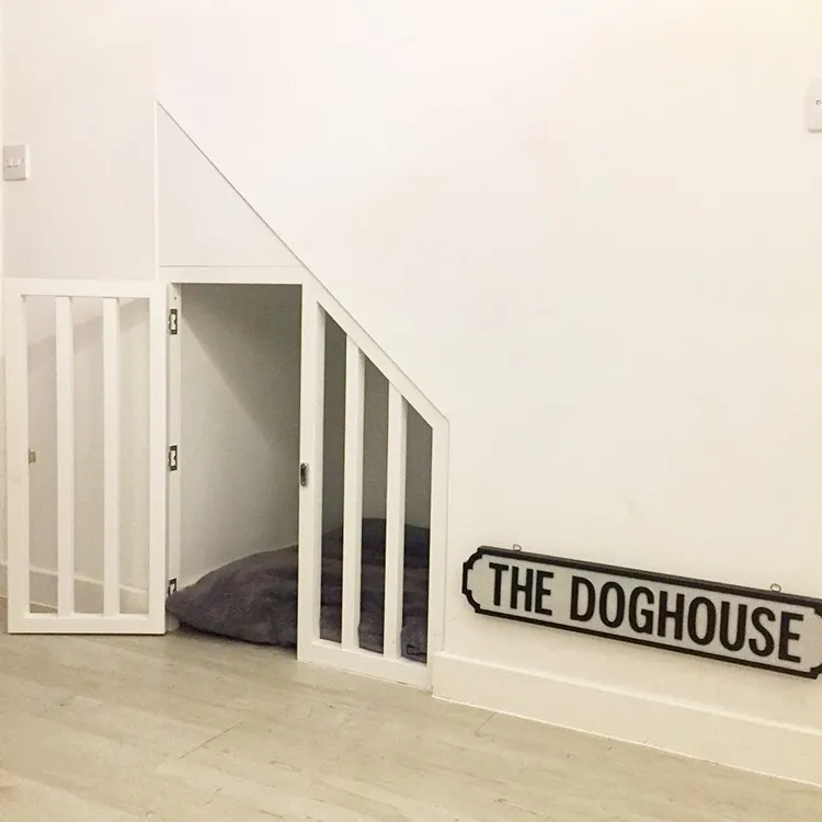 elegant minimalist under stairs dog house