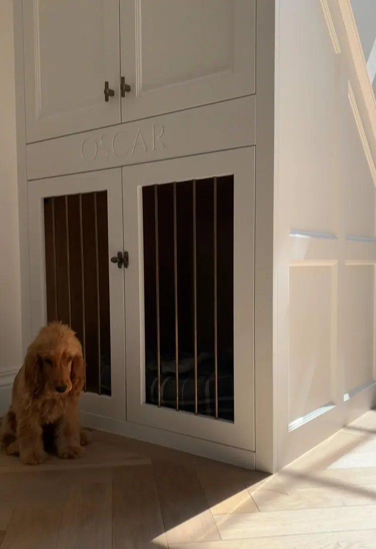 elegant under stairs dog house with closing doors