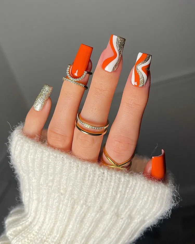 funky nail design with glitter orange idea