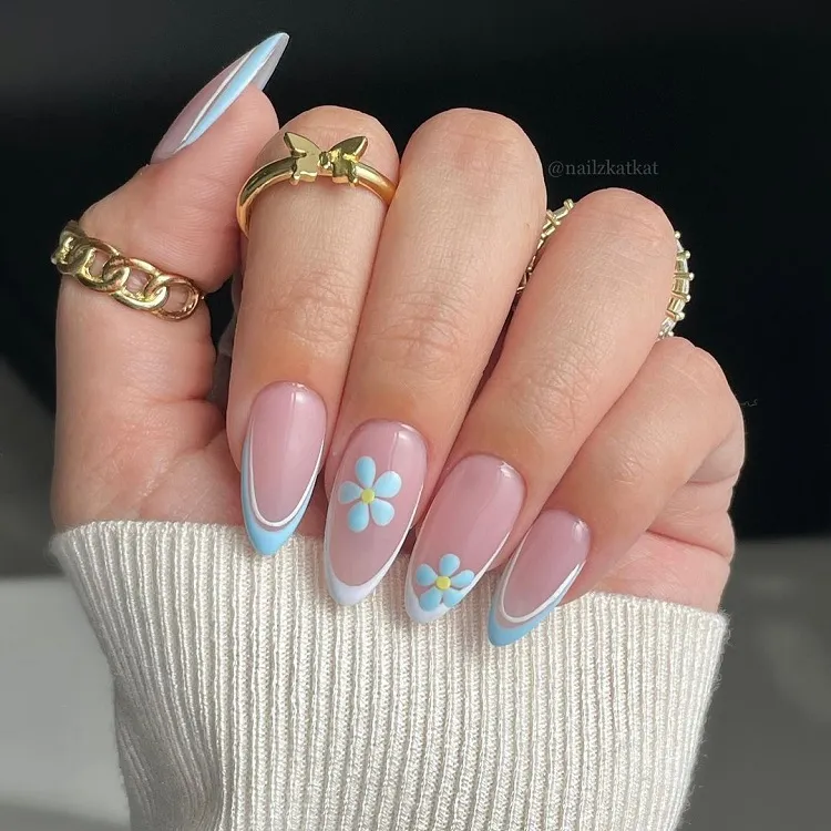 light blue french tip nails with flowers design