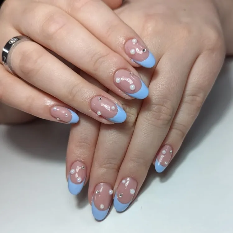 light blue french tips nails oval design with pearls