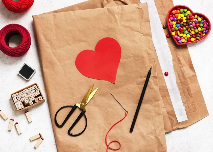 making paper heart valentine's day materials craft paper stencil scissors thread needle sweets