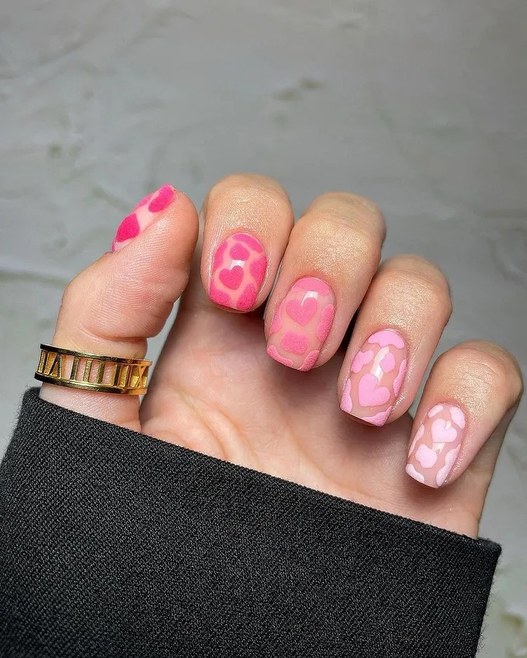 pink gradient valentines day manicure with hearts