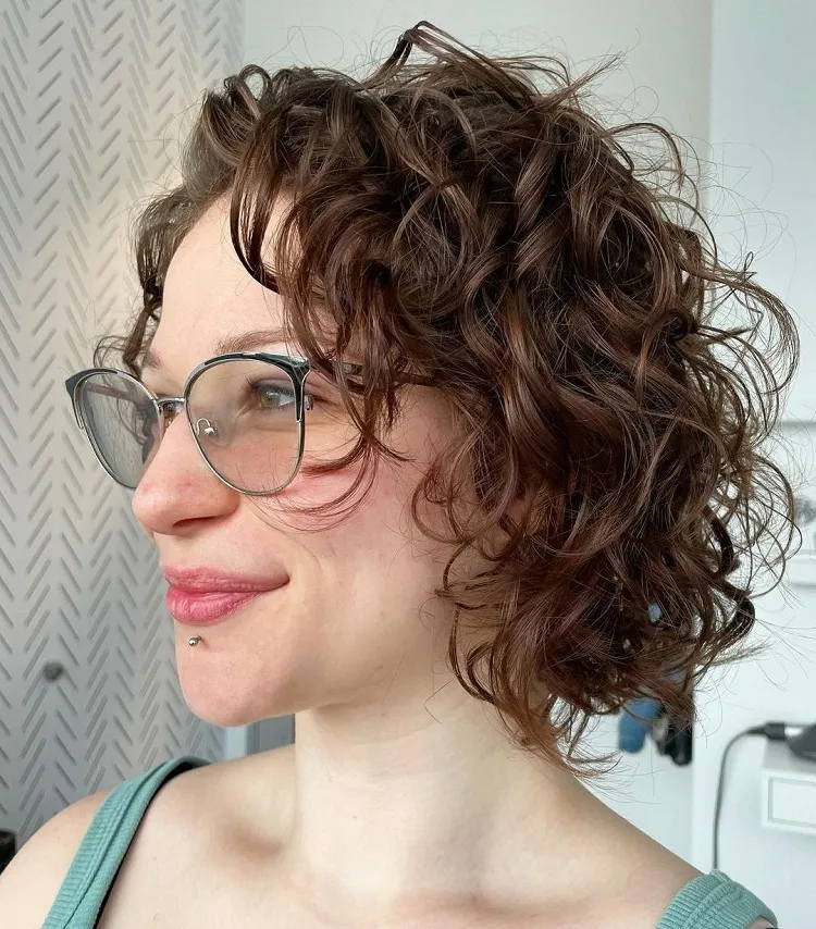 short layered curly hairstyle with glasses