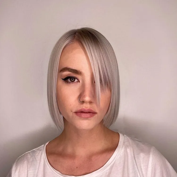 sleek blunt bob with side bangs for straight hair