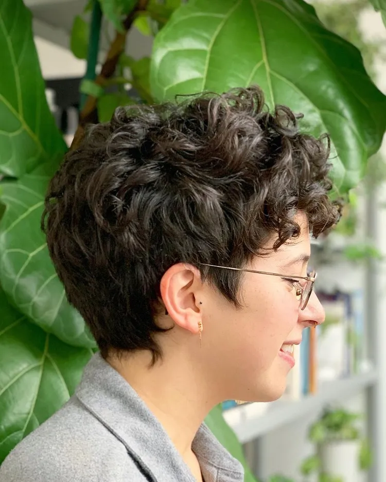 very short layered curly cut with glasses